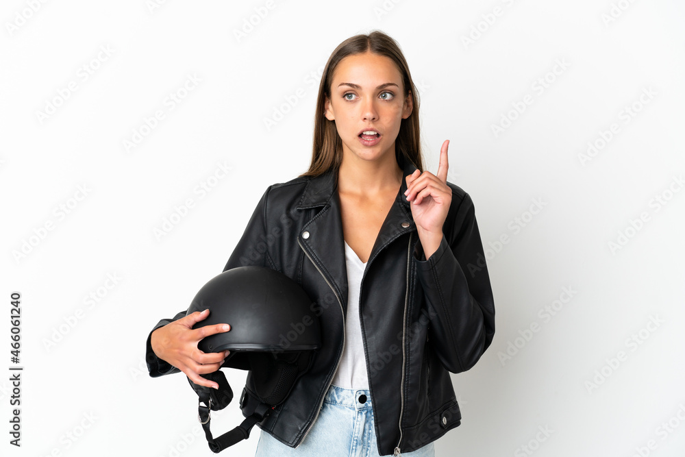 Woman with a motorcycle helmet over isolated white background thinking an idea pointing the finger up Woman with a motorcycle helmet over isolated white background thinking an idea pointing the finger up