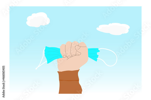End of coronavirus pandemic. Man holding used medical mask on clear sky background. End of coronavirus pandemic and back to normal life again. Copy space. Coronavirus stop concept, after COVID-19.