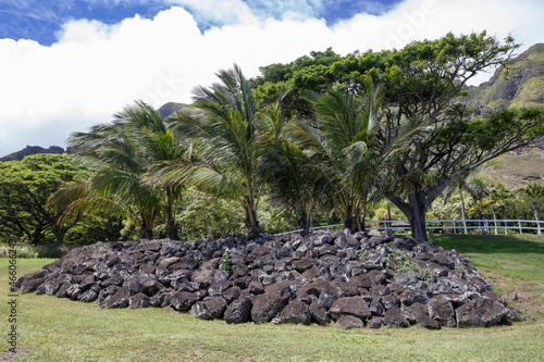 High mountain range covered in green plants with blue cloudy sky, Hawaii