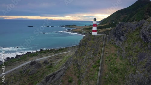 Aerial: Cape Palliser Lighthouse at the base of the North Island, New Zealand photo