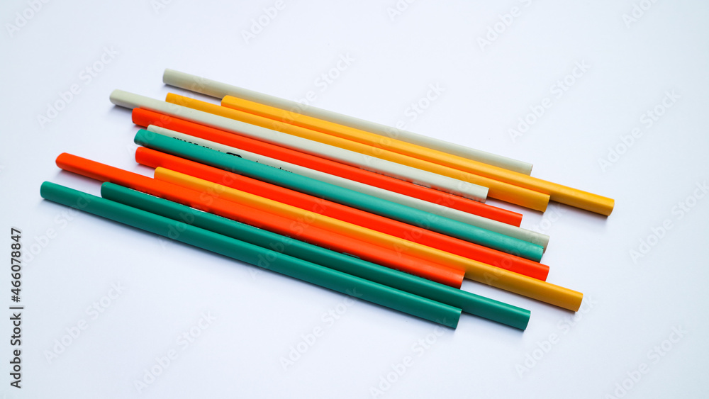 Pencils placed on white paper background with copy space for your image or text. Pencils placed on white paper background with copy space for your image or text.