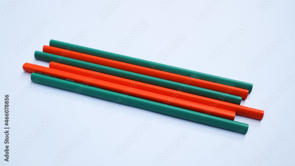 Pencils placed on white paper background with copy space for your image or text. Pencils placed on white paper background with copy space for your image or text.