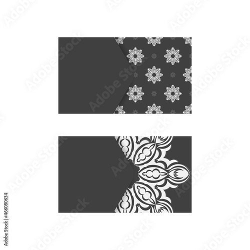 Black business card with Greek white pattern for your business.