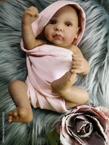 Cuadro en lienzo Lifelike ethnic reborn baby, toy