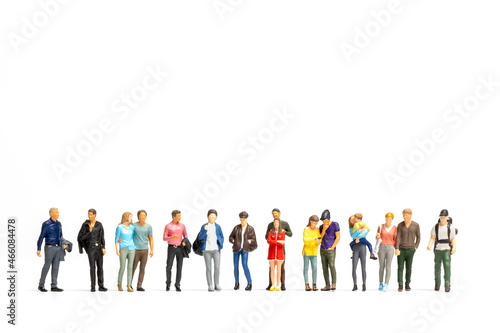 Group of Miniature people isolated on white background photo