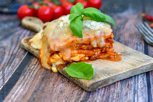   Delicious Home made keto diet  Lasagne bolognese  with  Lupin Flour, minced mea and tomato sauce   on a wooden rustic  background.Home made low carb italian meal