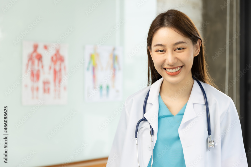 Confident young Asia female doctor in white medical uniform with stethoscope looking at camera and smiling health hospital.Portrait of a smiling doctor in office. Confident young Asia female doctor in white medical uniform with stethoscope looking at camera and smiling health hospital.Portrait of a smiling doctor in office.