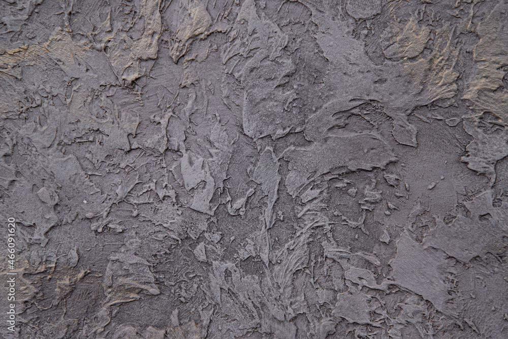 Plastered wall with an unusual pattern. Plaster background. Plastered wall with an unusual pattern. Plaster background.