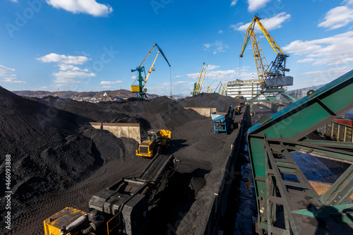 Coal transshipment port in the city of Nakhodka. Dirty coal handling facilities. Sea coal port.