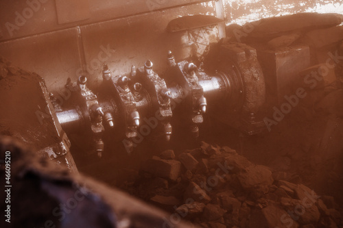 Extraction and processing of coal. The threshing machine grinds the pieces of coal.