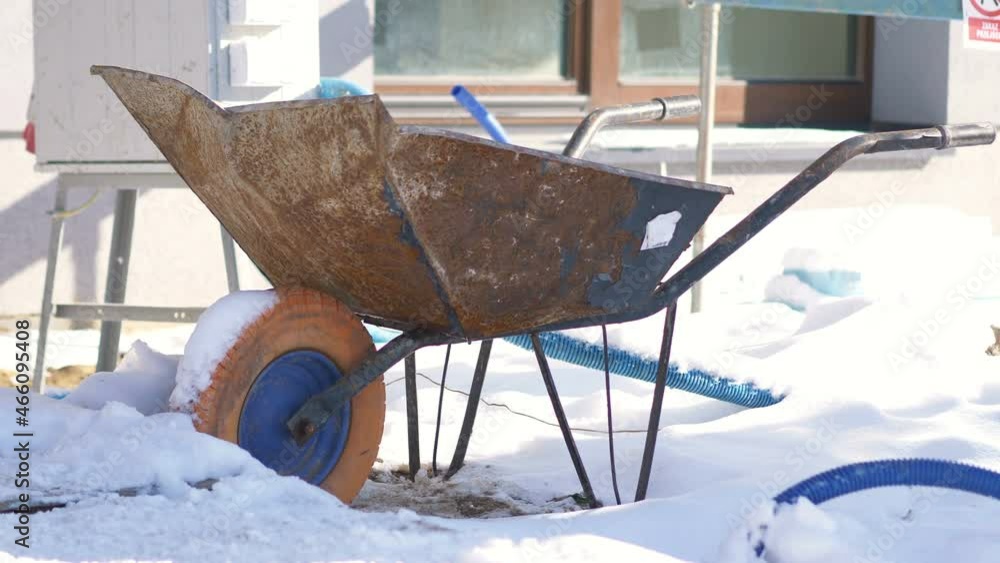 Wheelbarrow in the snow in 4k slow motion 60fps Wheelbarrow in the snow in 4k slow motion 60fps