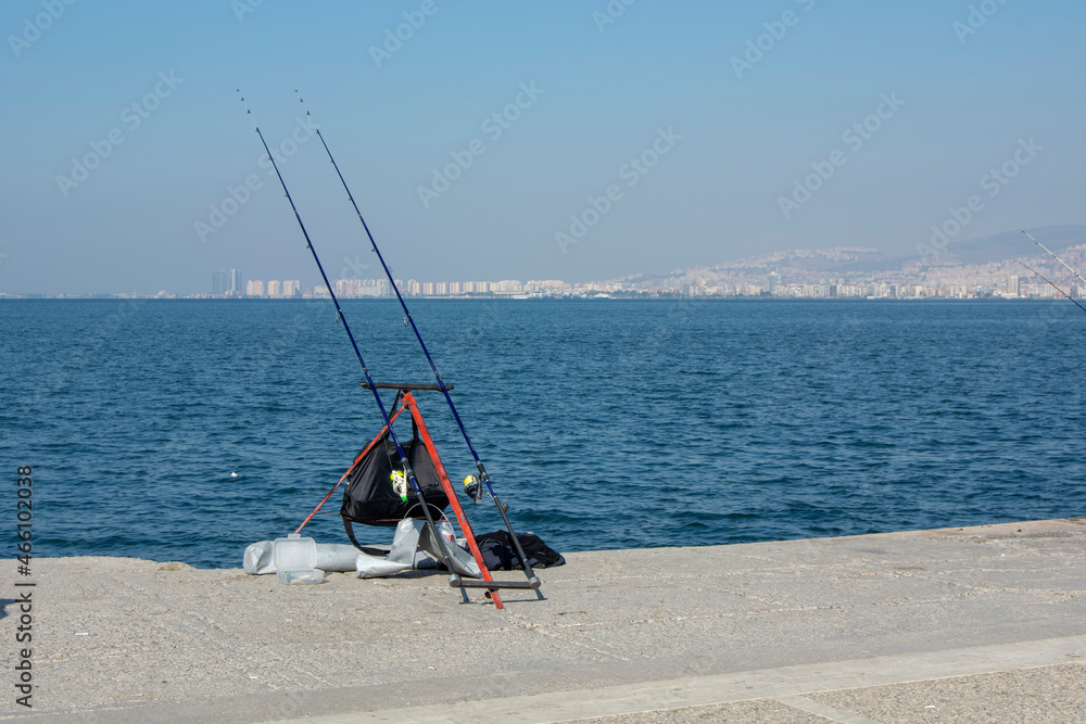 old man sitting by the sea and fishing old man sitting by the sea and fishing