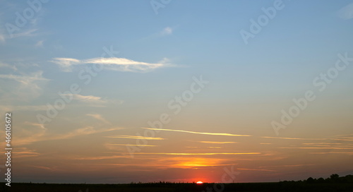 Scene of sunset in the summer with a cloudy sky background. Landscape © Oleh Marchak