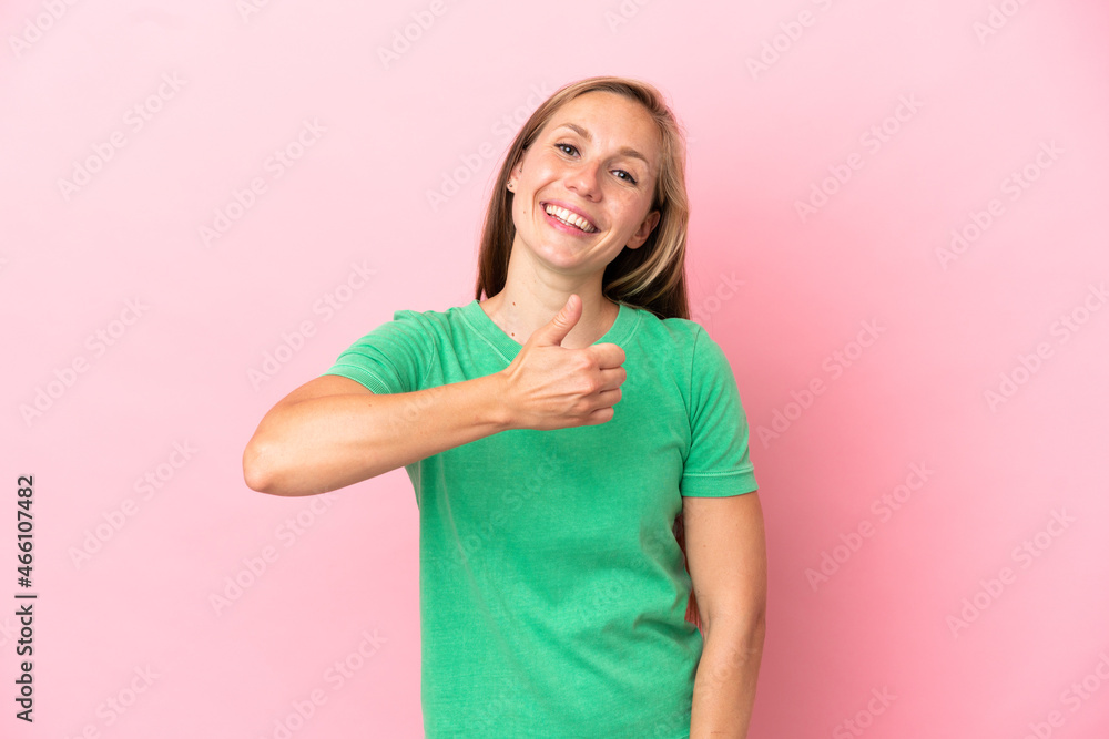 Young English woman isolated on pink background giving a thumbs up gesture Young English woman isolated on pink background giving a thumbs up gesture