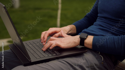 Young businessman hands busy working on laptop or computer keyboard for send emails and surf on a web browser. Using a laptop keyboard.