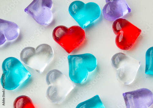 glass multicolored hearts on a white background