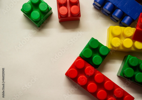 a multi-colored children's designer is lying on a white light table
