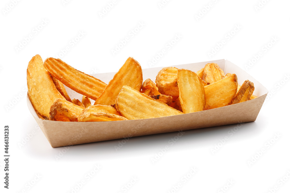 Baked potato slices in a cardboard tray on a white background isolated. Baked potato slices in a cardboard tray on a white background isolated.