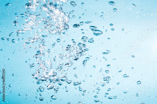 Bubbles of water on blue background