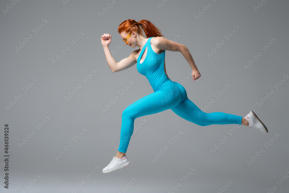 Excited sportswoman running during training