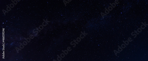 Fototapeta Naklejka Na Ścianę i Meble -  Panorama blue night sky milky way and star on dark background.Universe filled with stars, nebula and galaxy with noise and grain.Photo by long exposure and select white balance.selection focus.amazing