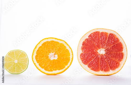section of grapefruit, orange and lime on a white background, isolate. The concept of vitamins, freshness, naturalness. High quality photo