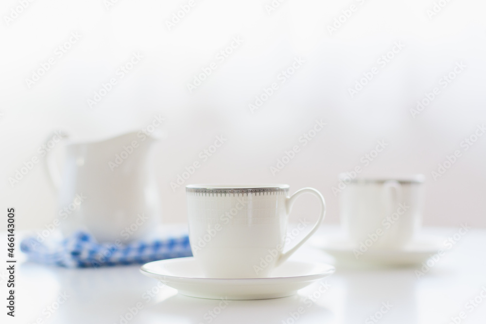white porcelain tea set on natural background. white porcelain tea set on natural background.