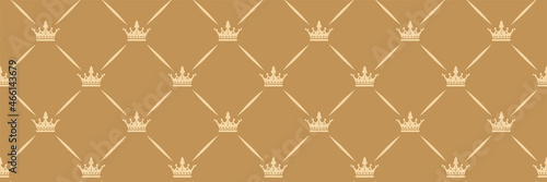 Beautiful background image with royal crowns on a gold background for your design. Seamless background for wallpaper, textures. 