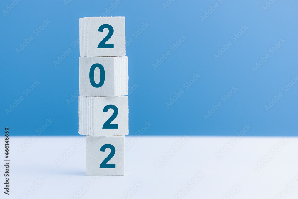 Vertical wooden cube with number 2022, start up for New Year 2022, Happy New Year changing year. Vertical wooden cube with number 2022, start up for New Year 2022, Happy New Year changing year.