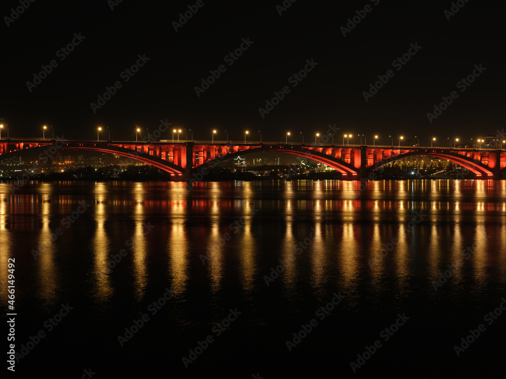 Fototapeta premium cityscape bridge over the river at night