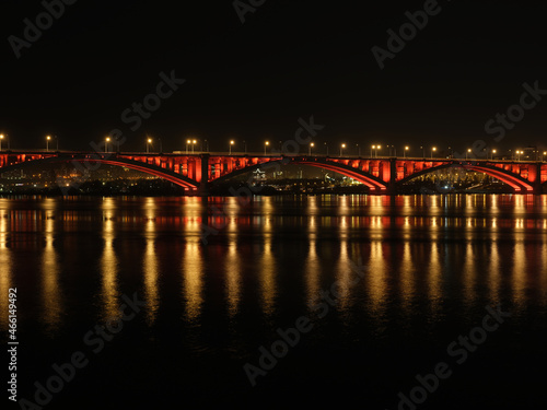 cityscape bridge over the river at night © evgenii_v