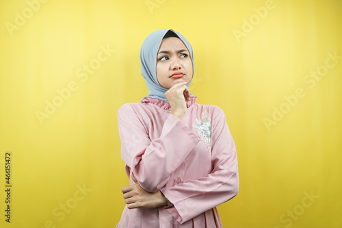 Beautiful young muslim woman thinking, confused, isolated