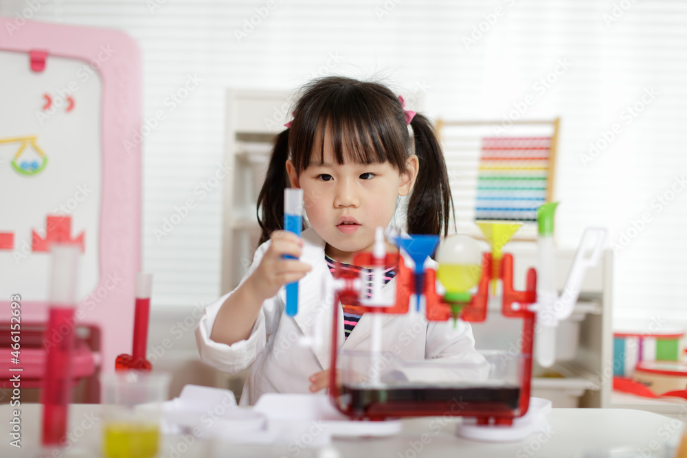 young girl plays colour mixing science experiment for home schooling young girl plays colour mixing science experiment for home schooling