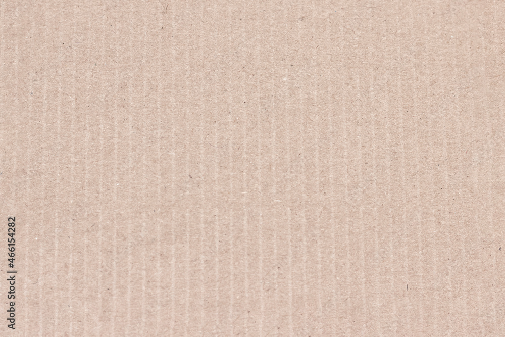 A sheet of light brown cardboard. A sheet of light brown cardboard.