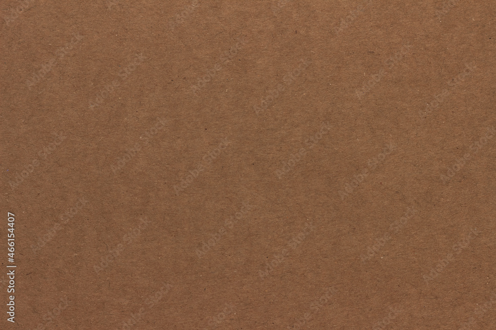 A sheet of light brown cardboard. A sheet of light brown cardboard.