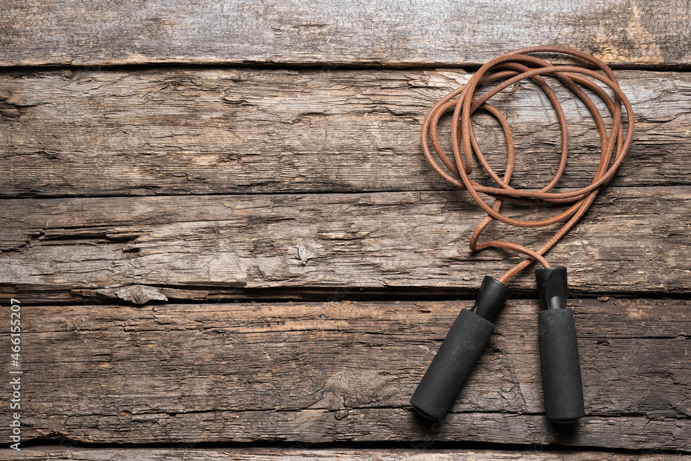 Skipping rope on the old wooden floor background with copy space. Skipping rope on the old wooden floor background with copy space.