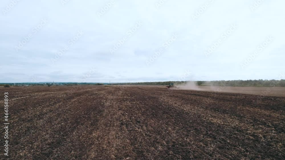 Agriculture in Russia, the work of a combine harvester in the field, preparing the land for winter