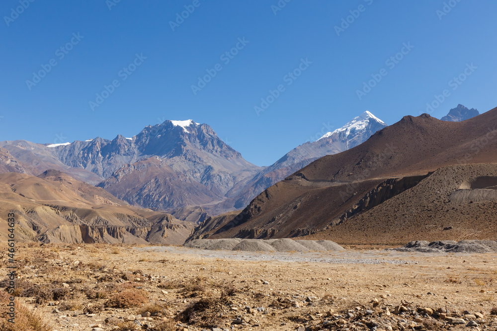 Yakwakang and Khatungkang mountains. Thorung La Pass. View from the village of Kagbeni. Mustang District, Nepal Yakwakang and Khatungkang mountains. Thorung La Pass. View from the village of Kagbeni. Mustang District, Nepal