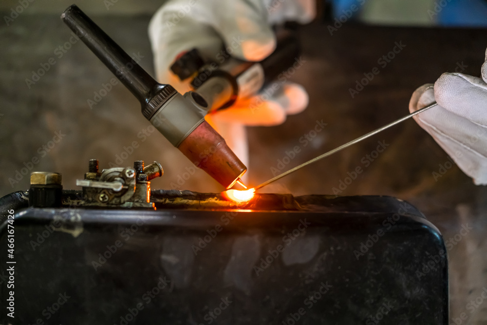 TIG welding. Welding the fuel tank of a motor pump by electric arc