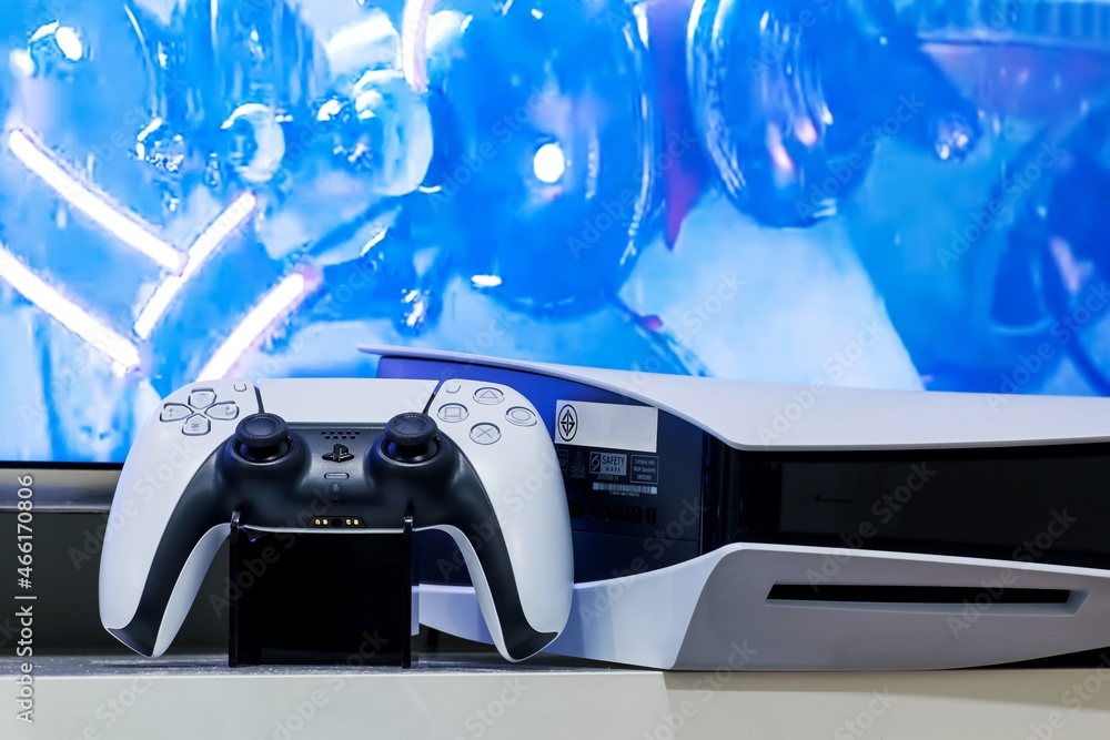 Bangkok, Thailand - June 20, 2021 : Playstation 5 DualSense wireless  controller with side of playstation 5 on TV stand and screen of TV, New  Sony gaming console. Stock Photo | Adobe Stock