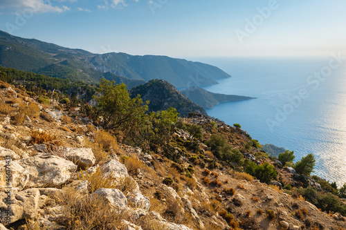 Turkey costal landscape at sunset, taken on mediterranean Turkish coast trekking route of Lycian way by sea. Nature, outdoor, hiking and trekking concept image