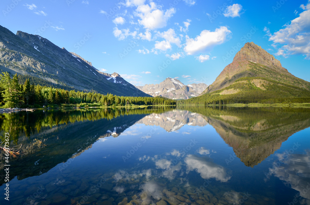 Mount Gould and Mount Grinnell reflected in Swiftcurrent Lake Mount Gould and Mount Grinnell reflected in Swiftcurrent Lake