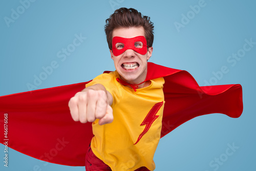 Photography Funny superhero flying in studio