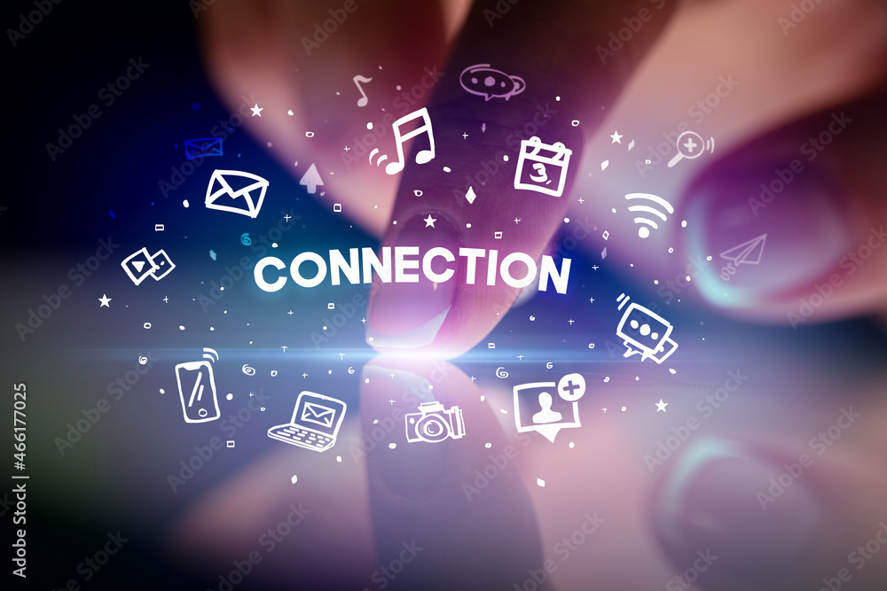 Finger touching tablet with social media icons concept Finger touching tablet with social media icons concept