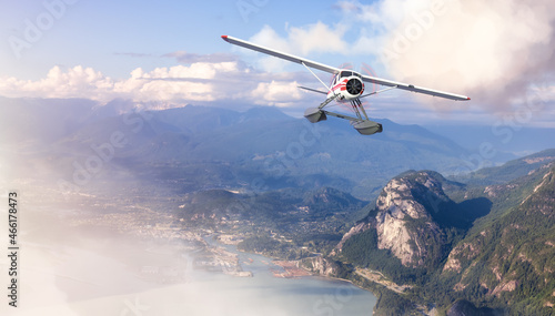 Seaplane Flying over the touristic town and Mountains Landscape. Extreme Adventure Composite. 3D Rendering Airplane. Aerial Background Image from Squamish, British Columbia, Canada.