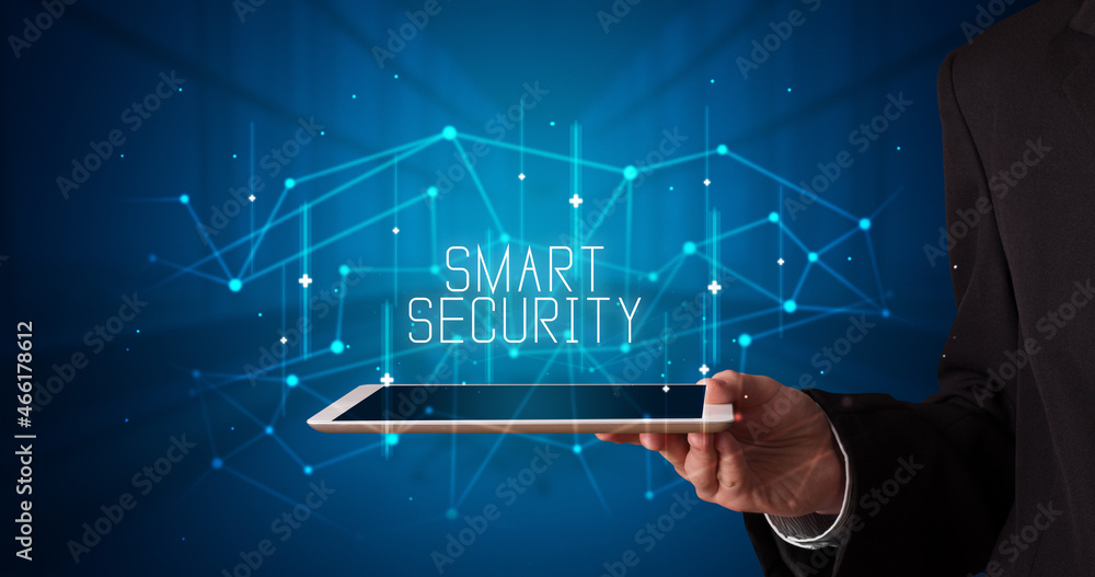 Person holding tablet, security concept Person holding tablet, security concept