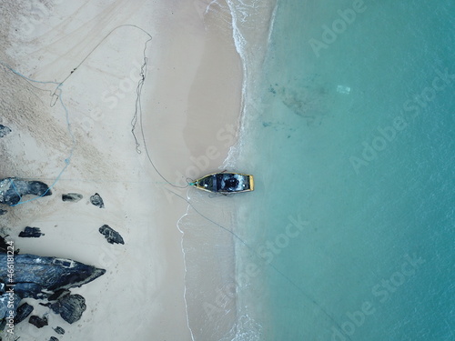 Fishing boat in Buzios beach at Rio de Janeiro, BR. Photo taken from a drone