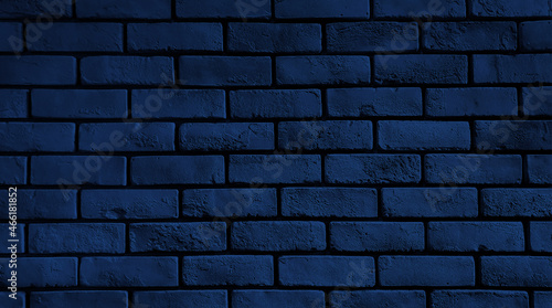rustic dark blue brick wall texture for an abstract vintage background. close up brick facade for loft architectural concept.