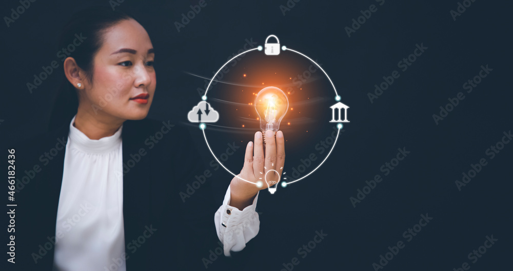 New Target business and light bulb concept, Businesswoman holding light bulb,innovative idea of inspiration from online technology, Changes in new planning, Business growth, ideas and perspectives. New Target business and light bulb concept, Businesswoman holding light bulb,innovative idea of inspiration from online technology, Changes in new planning, Business growth, ideas and perspectives.