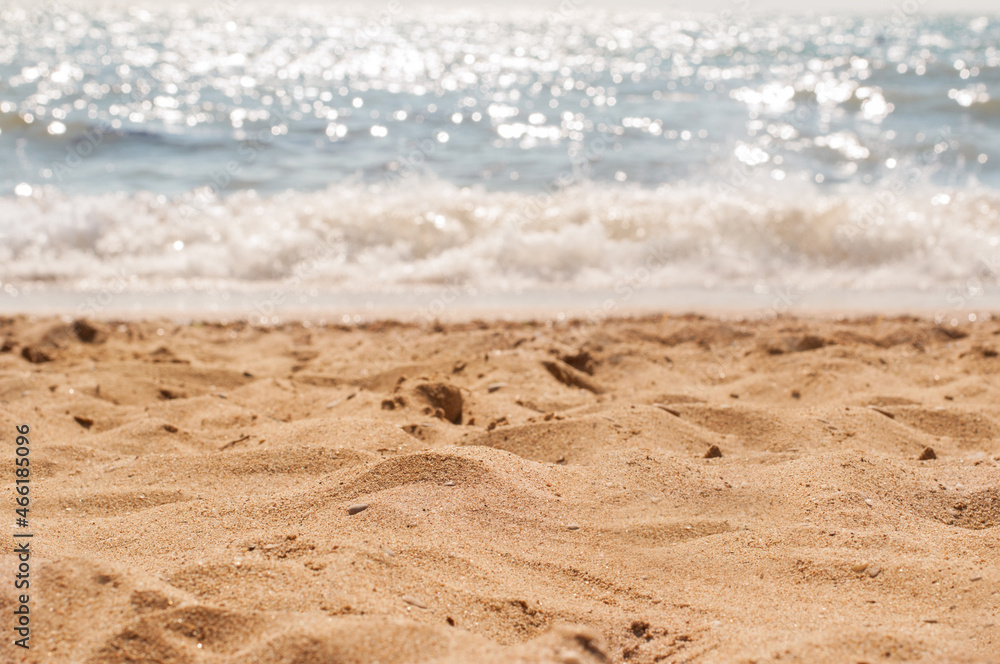 The coast with a yellow sandy beach and blue sea water